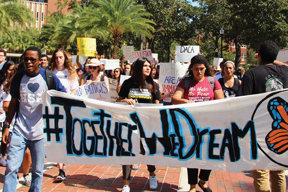 Newspaper photo of Students Marching Across UF to Support Deferred Action for Childhood Arrivals (DACA), September 29, 2017